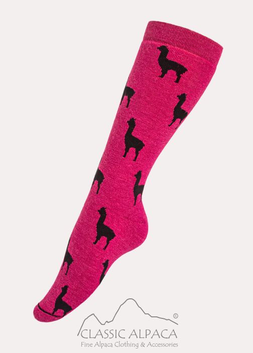 A pink sock with black deer on it