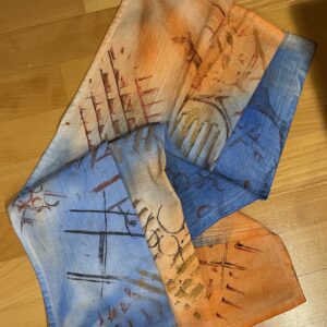 A scarf with hands and a map on it