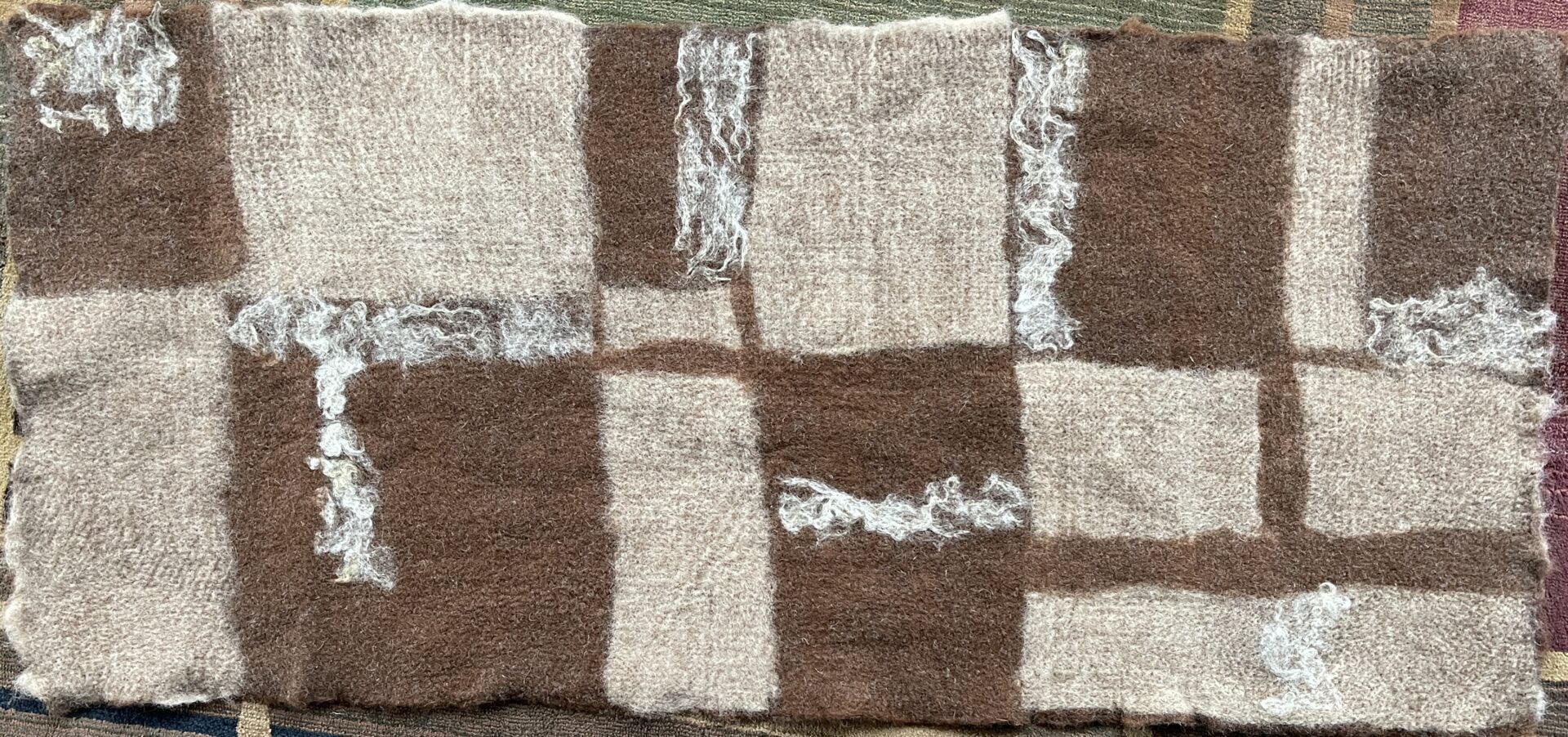 A close up of the brown and white squares