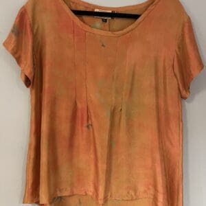 A t-shirt that is made of orange and brown fabric.