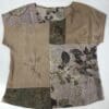A brown and green shirt with leaves on it