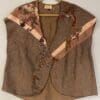 A brown vest with a floral design on it.