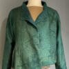A green jacket is shown on the mannequin.