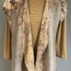 A tan jacket with a floral print on it.
