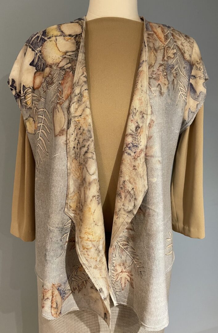 A tan jacket with a floral print on it.