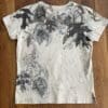 Beige t-shirt with leaf print.