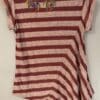 Red and beige striped shirt with floral detail.