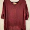 Burgundy v-neck high-low blouse.