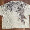 Eco-printed beige t-shirt with leaf design.