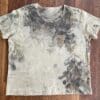 Eco-printed beige t-shirt with leaf design.