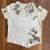 Moldy off-white shirt with leaf print.