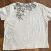Off-white shirt with botanical print.