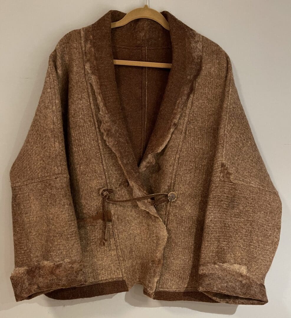 Brown wool jacket with tie belt.