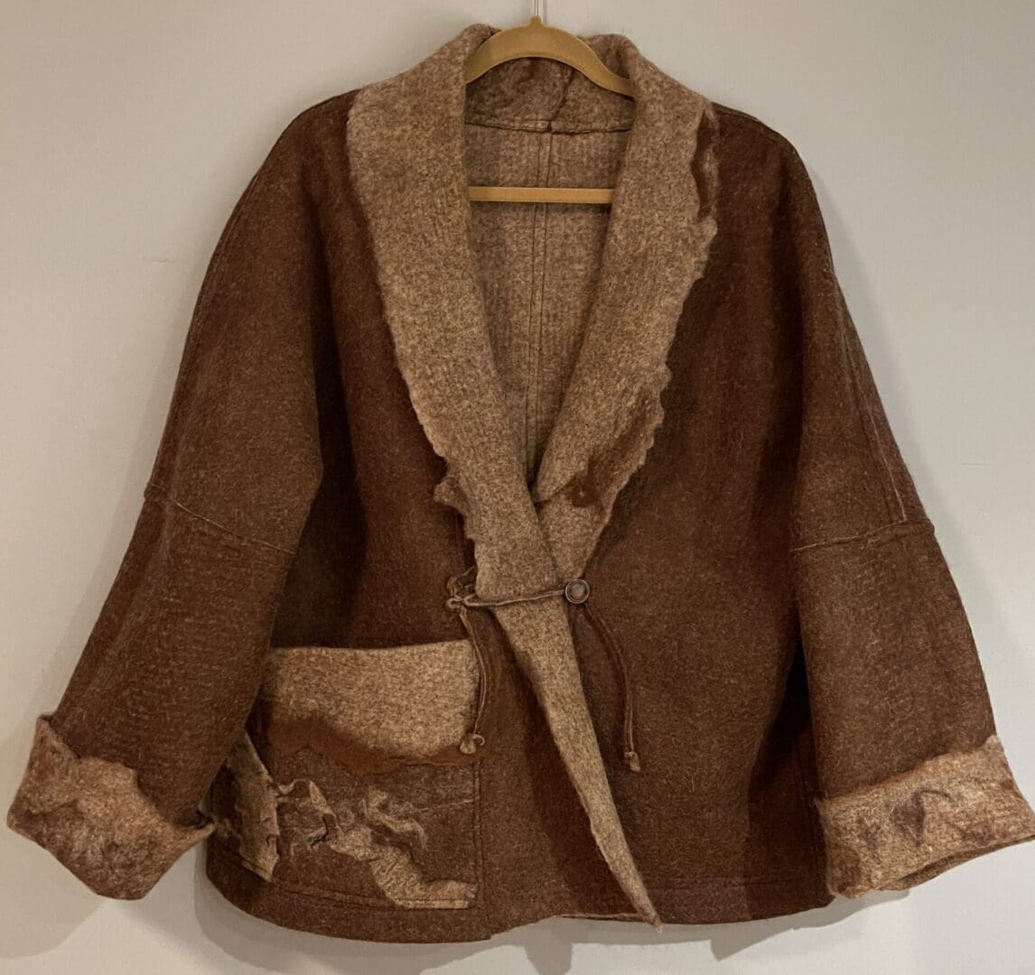 Brown wool jacket with beige accents.